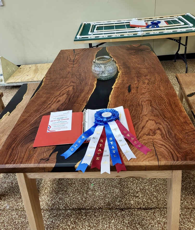 Students celebrating SkillsUSA victories with awards and smiles.