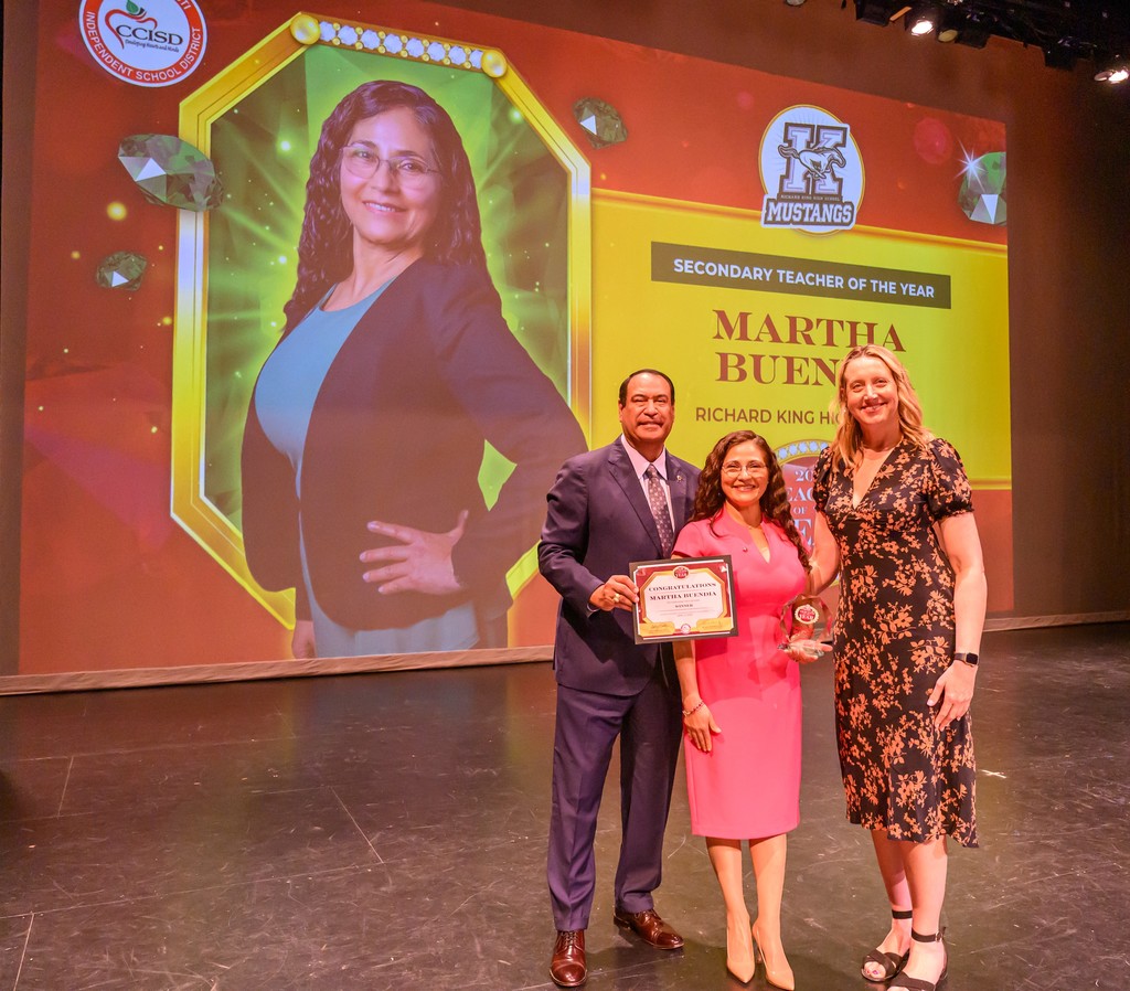 Superintendent Dr. Roland Hernandez, Secondary Teacher of the year Martha Buendia and King high school principal dr. prudence farrell pose for a photo at the teacher of the year ceremony. 