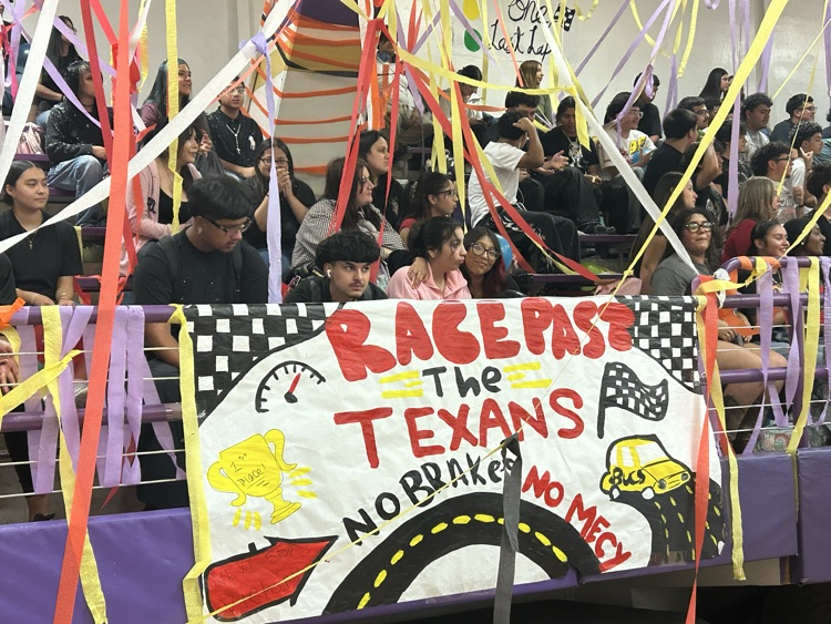 image includes students enjoying the pep rally