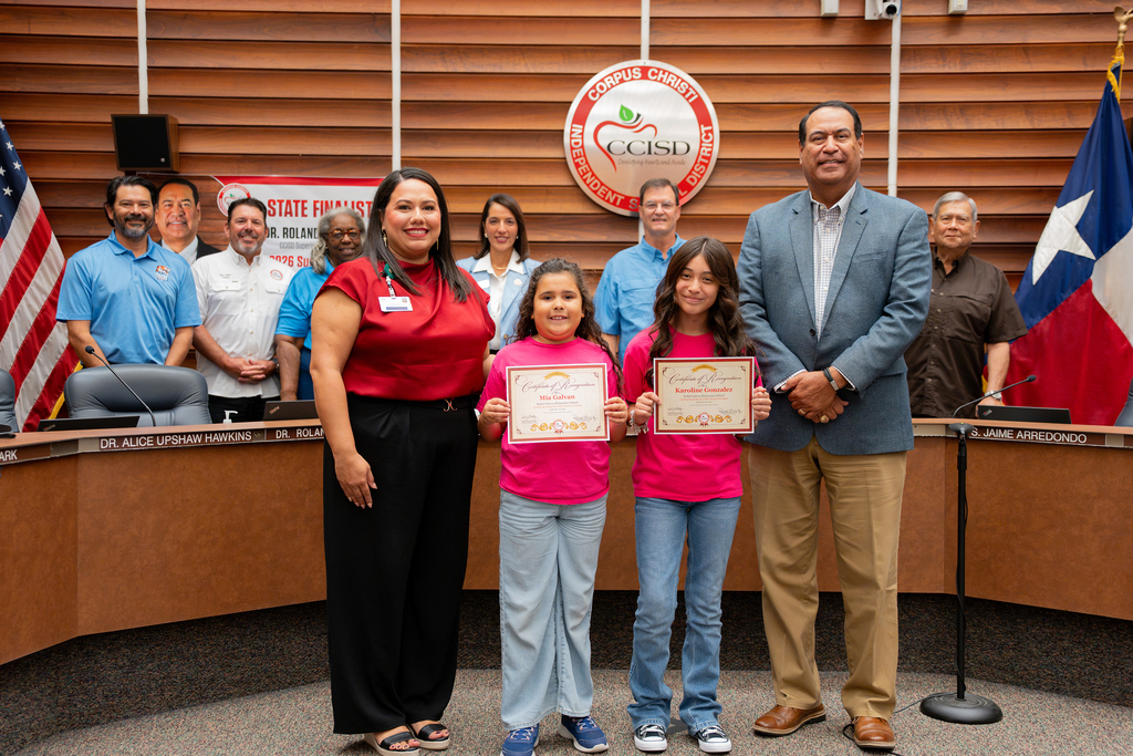 Galvan Elementary School students at the Sept. 298 BOard meeting pose for a photo with the superintendent. 