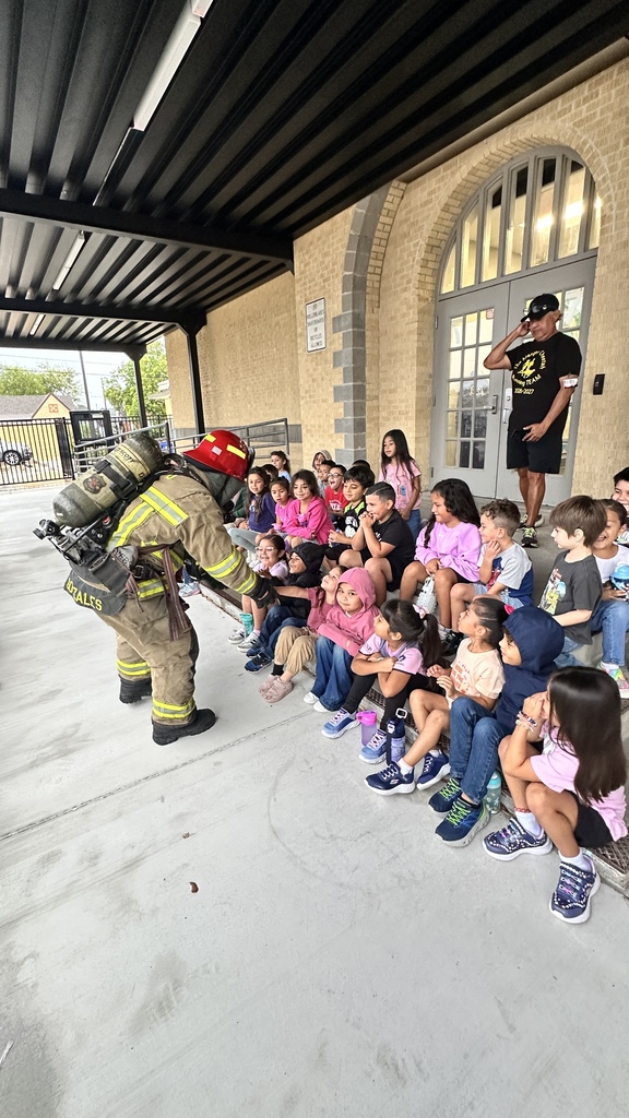 Firefighter with students