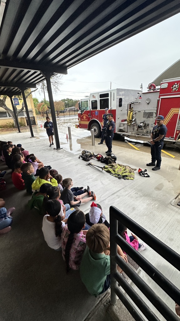 students listening to firefighter