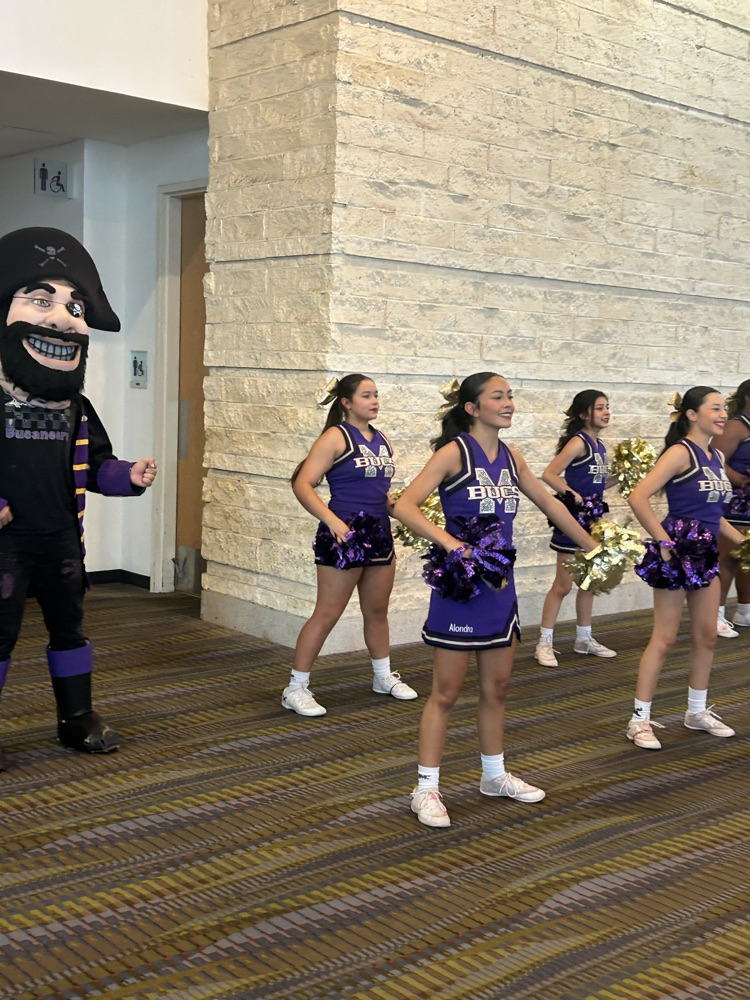 cheer and mascot greet visitors as they arrive