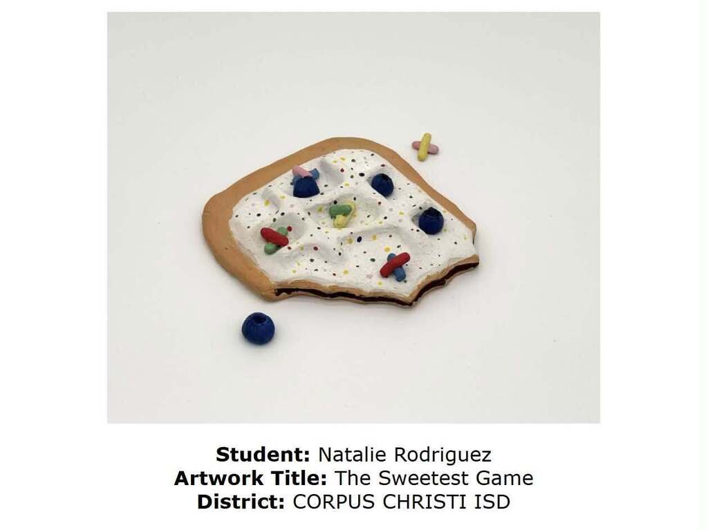 Edible artwork of a cookie, with frosting, sprinkles, and blueberries. Created by student Natalie Rodriguez from Corpus Christi ISD.