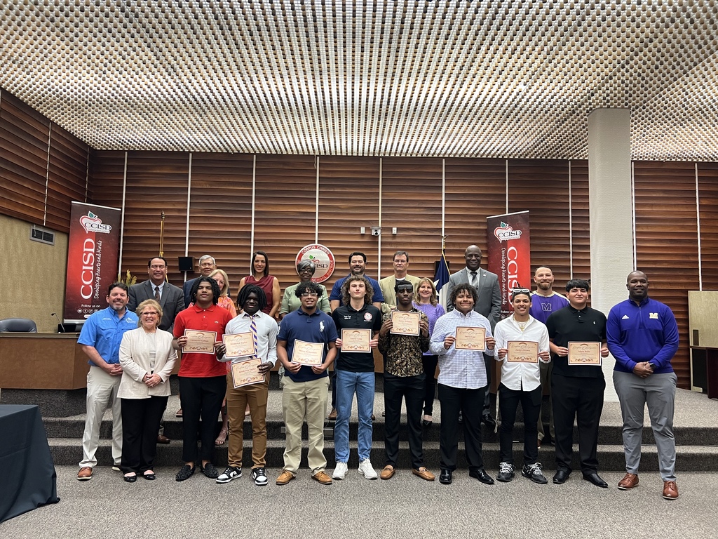 People standing with award
