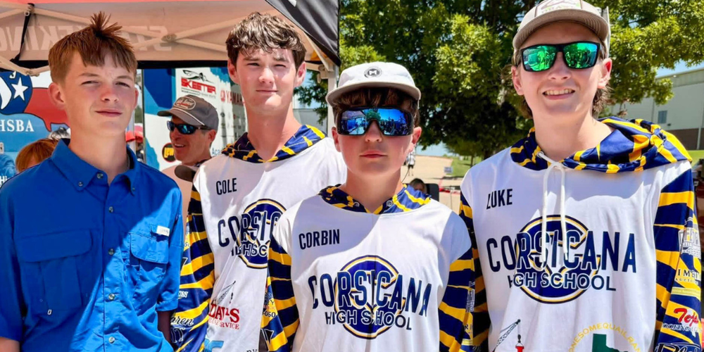 Four students in matching Corsicana High School fishing team jerseys stand outdoors under a canopy, with names “Cole,” “Corbin,” and “Luke” visible on the shirts.
