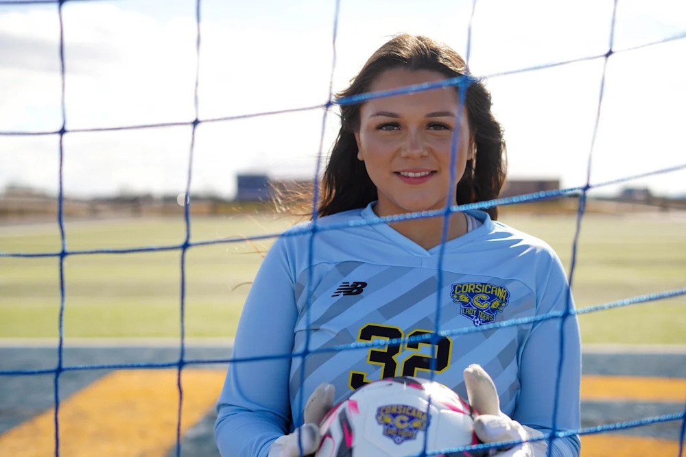 Lexus Almanza smiling holding soccer ball