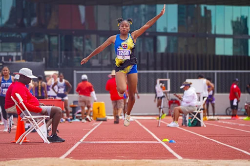 athlete running at state track meet