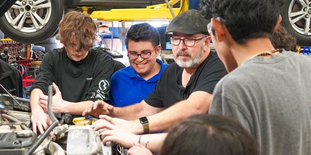 a teacher discusses engine repair in auto tech class