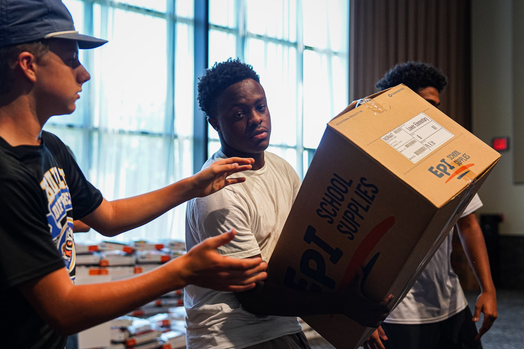 Students lifting boxes