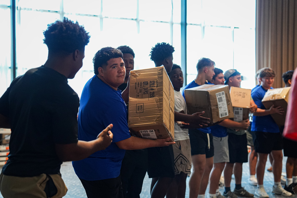 Students lifting boxes