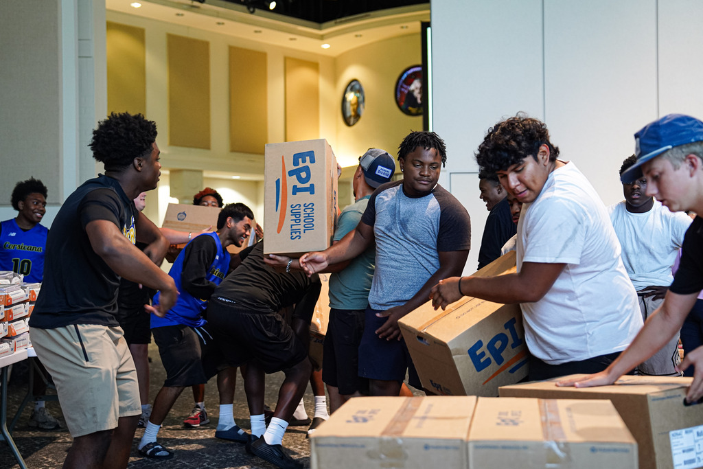 Students lifting boxes
