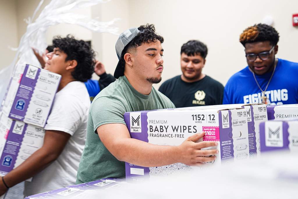 Students lifting boxes