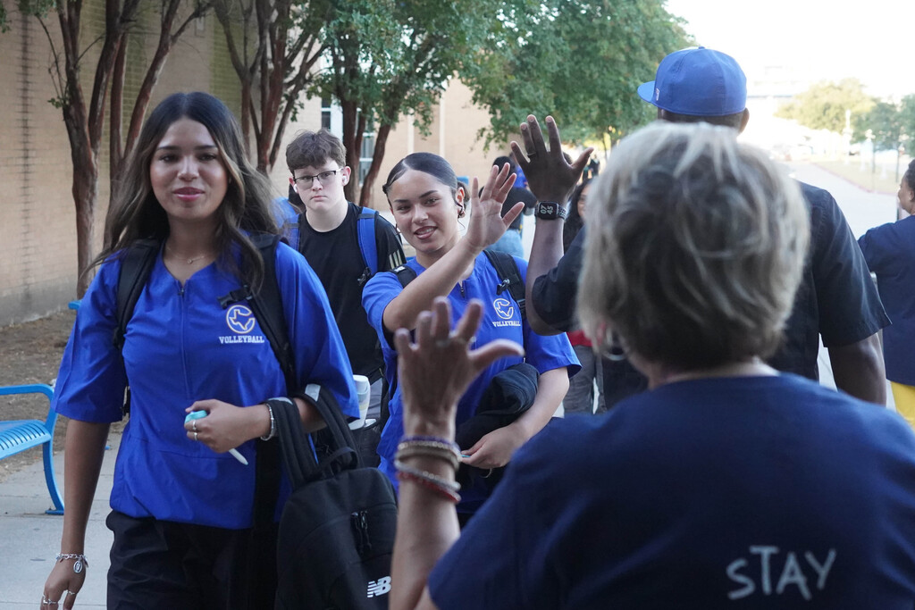 Students entering Corsicana High School receive high fives on You matter Day