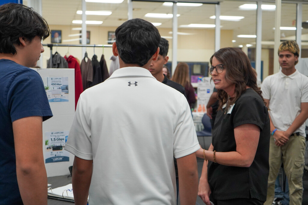 Corsicana High School Honors Economics students set up shop in the library with mock business plans, financial projections, and product samples