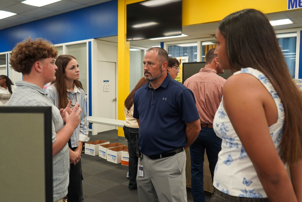 Corsicana High School Honors Economics students set up shop in the library with mock business plans, financial projections, and product samples
