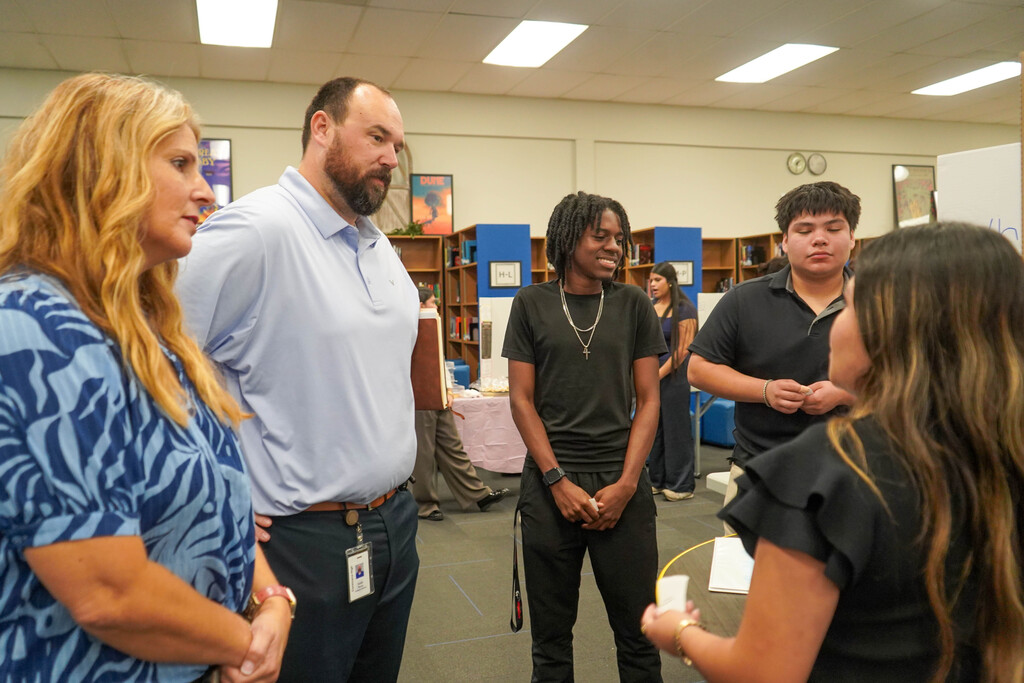 Corsicana High School Honors Economics students set up shop in the library with mock business plans, financial projections, and product samples