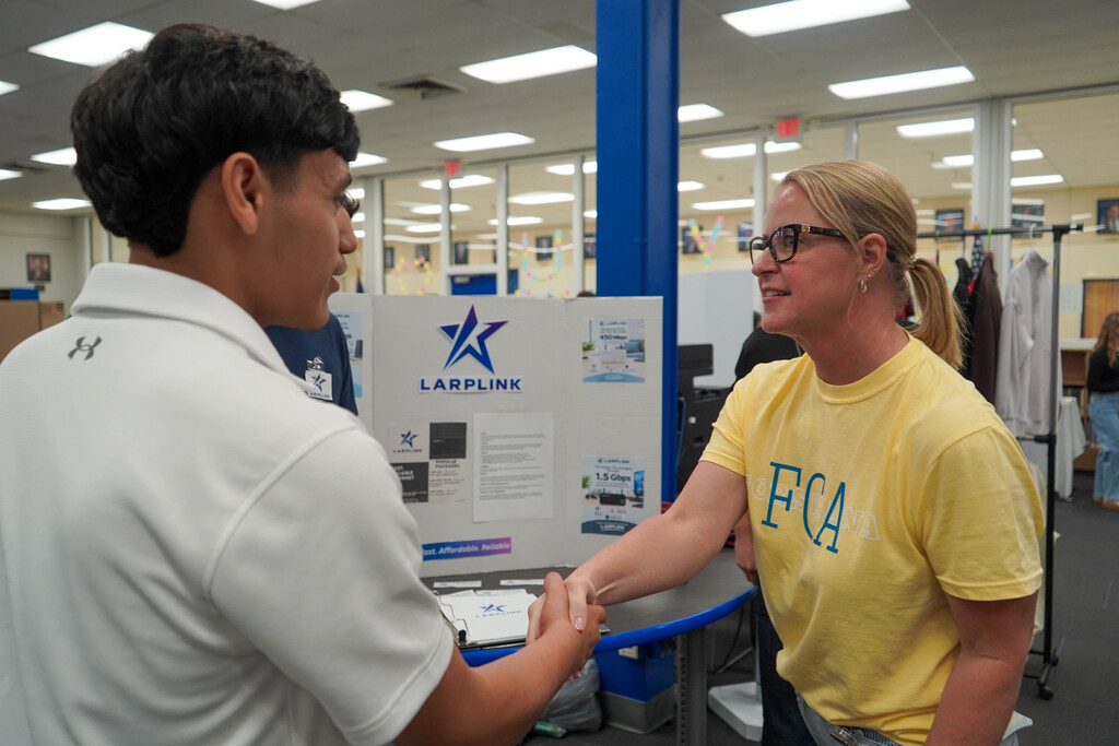 Corsicana High School Honors Economics students set up shop in the library with mock business plans, financial projections, and product samples