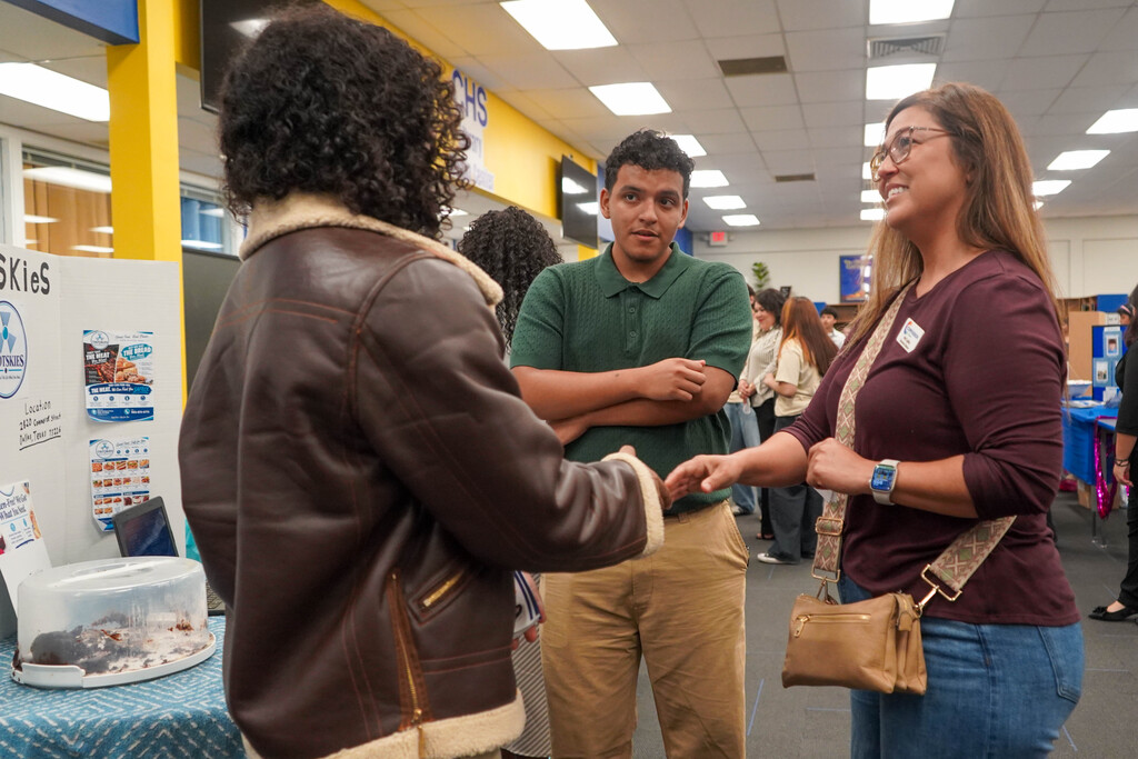 Corsicana High School Honors Economics students set up shop in the library with mock business plans, financial projections, and product samples