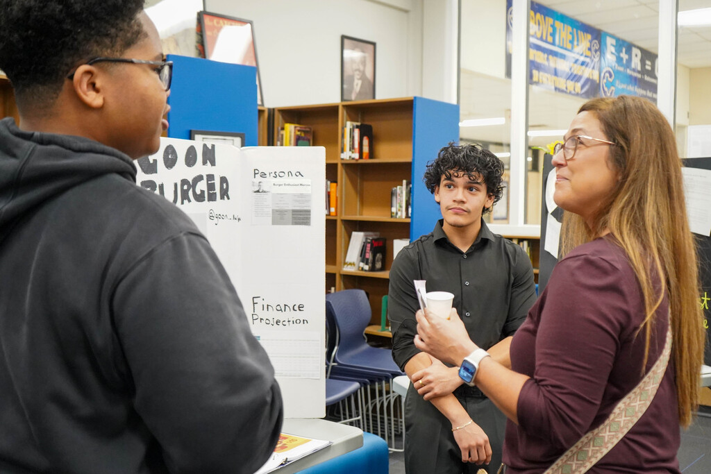 Corsicana High School Honors Economics students set up shop in the library with mock business plans, financial projections, and product samples