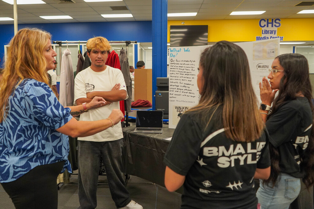 Corsicana High School Honors Economics students set up shop in the library with mock business plans, financial projections, and product samples