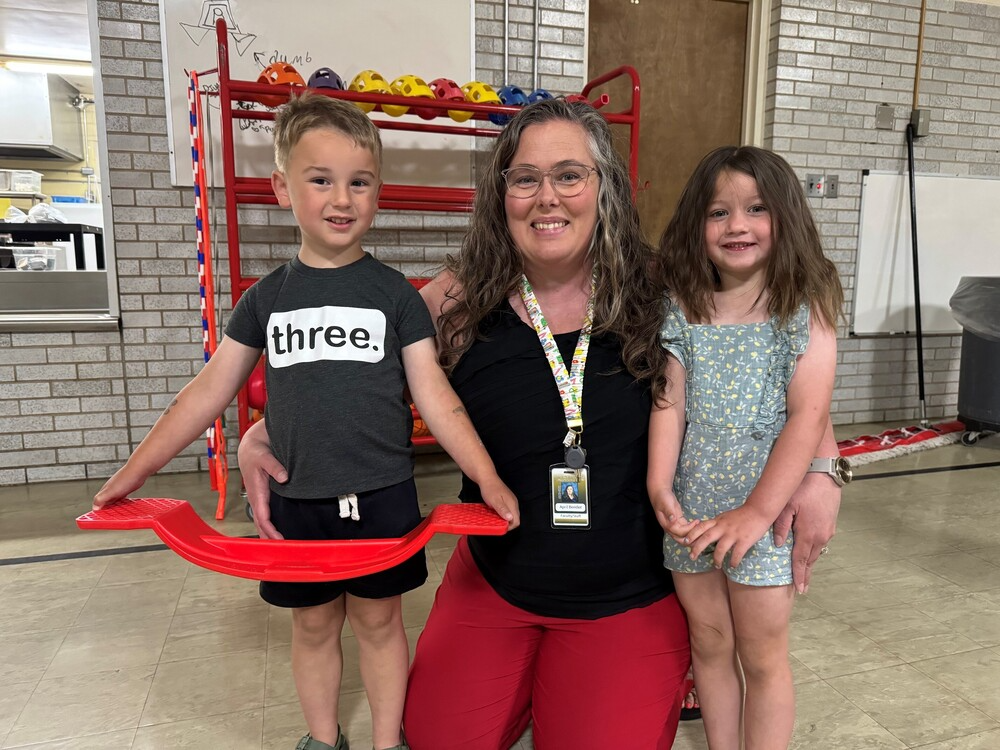 April Bentler with two students