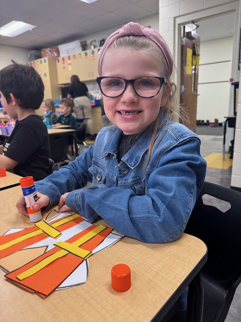 Kindergarten student making craft