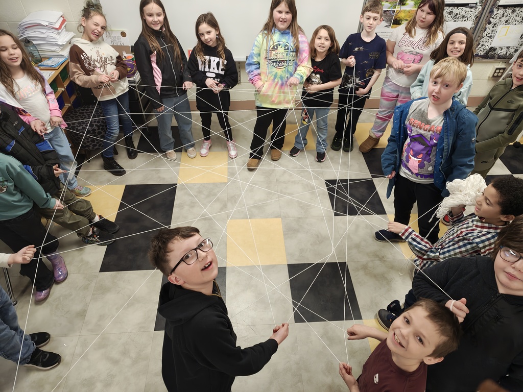 Students building a spider web