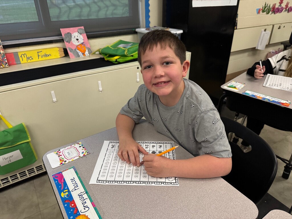 Boy working on money problems.