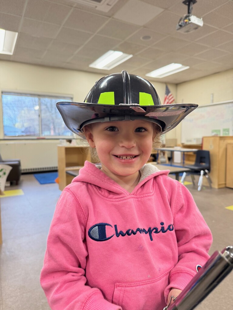 Student in fireman's hat