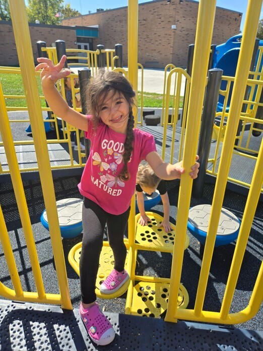 child on playground equipment
