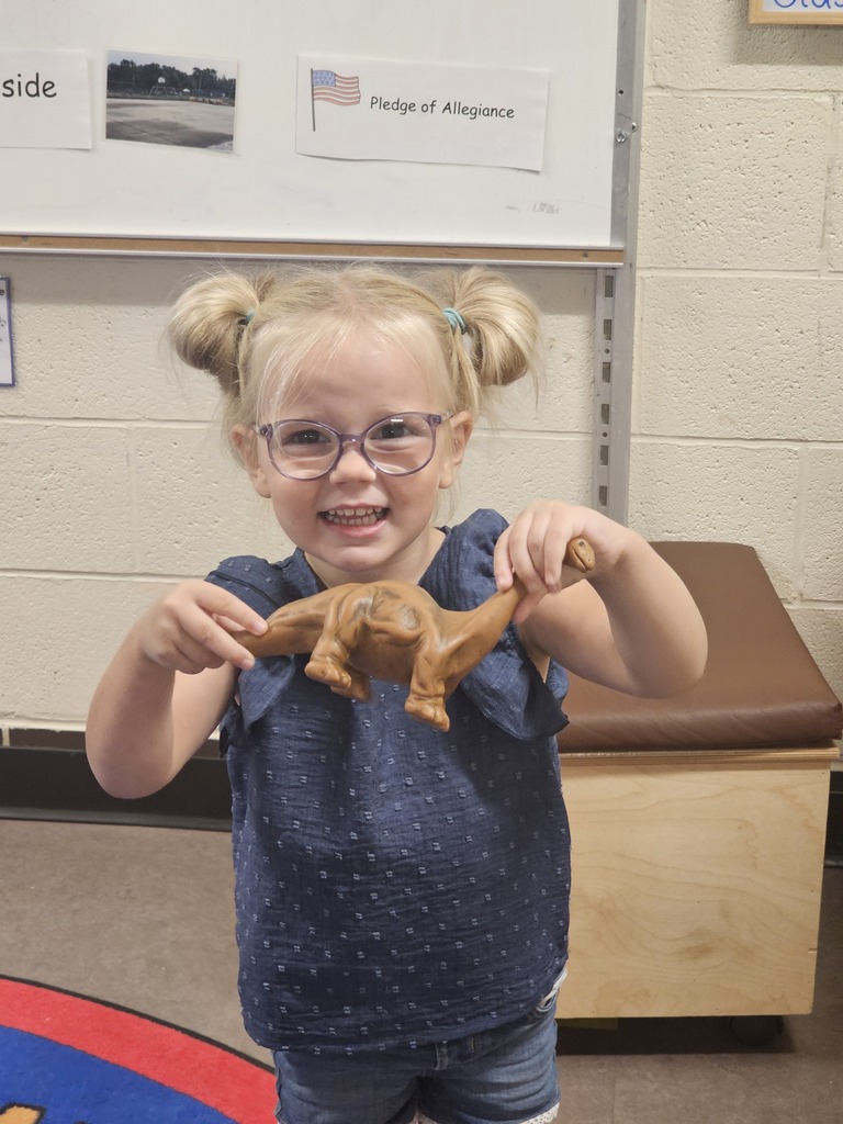 Girl wit dinosaur