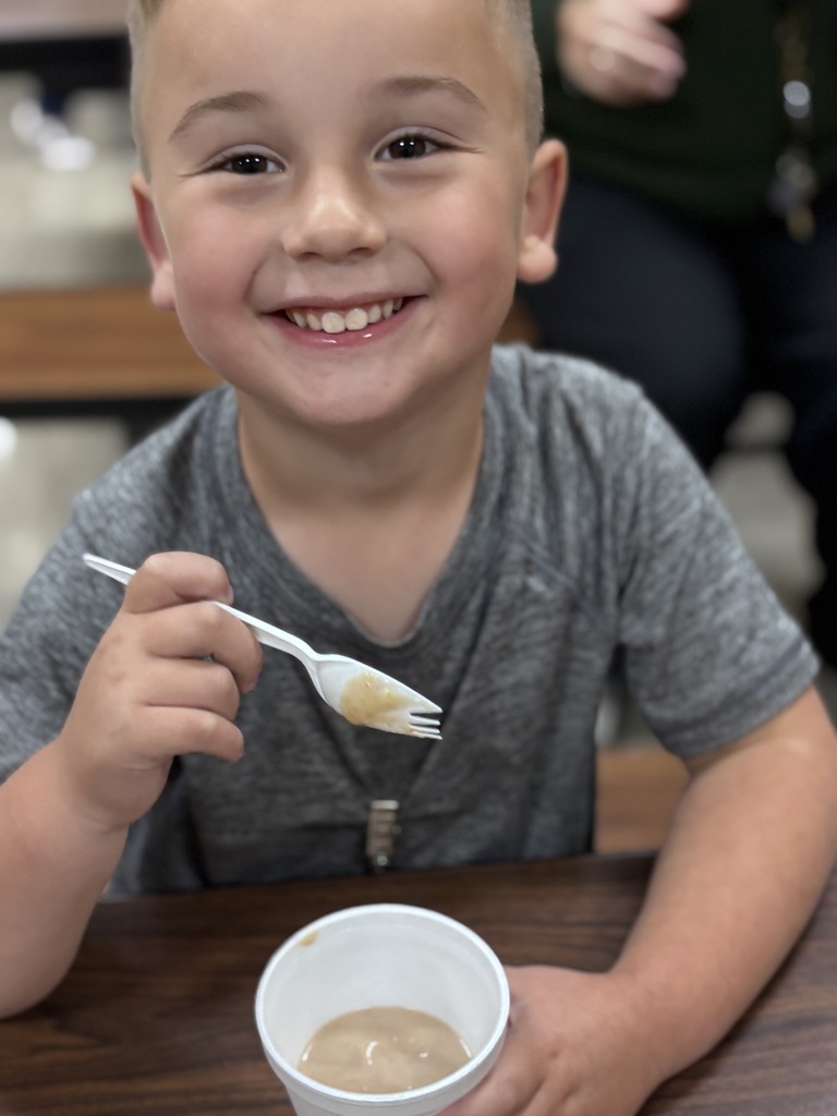 child eating a smoothy