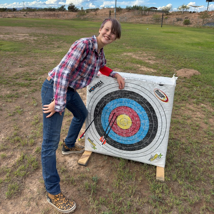 girl next to bullseye
