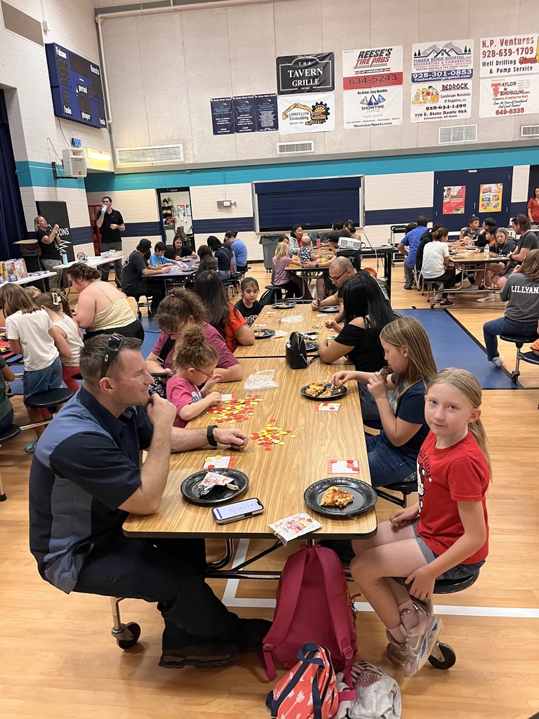 Eating pizza and chatting at Bingo Night
