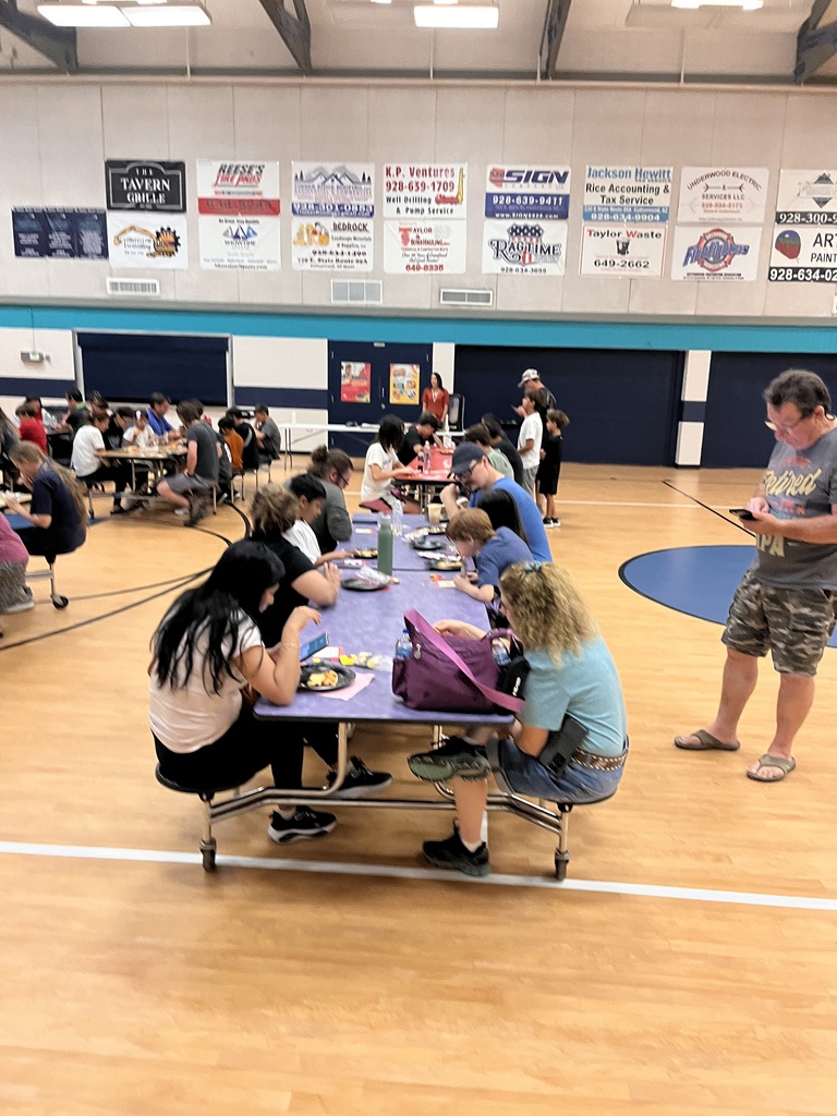 Eating pizza and chatting at Bingo Night