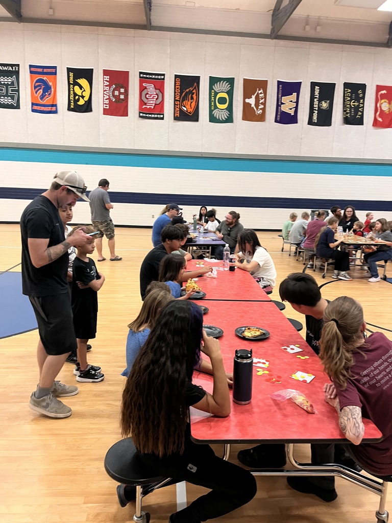Eating pizza and chatting at Bingo Night