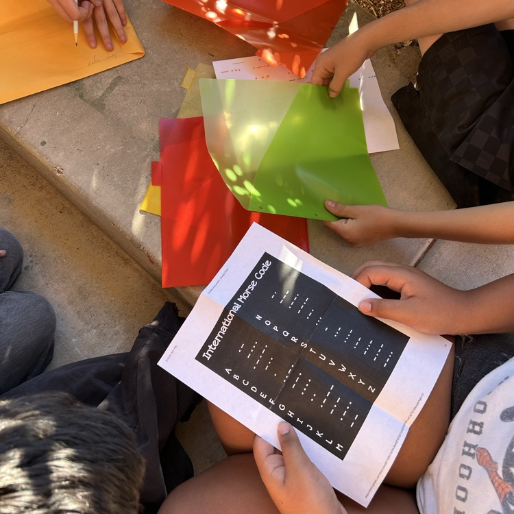 students figuring out puzzle to unlock clues