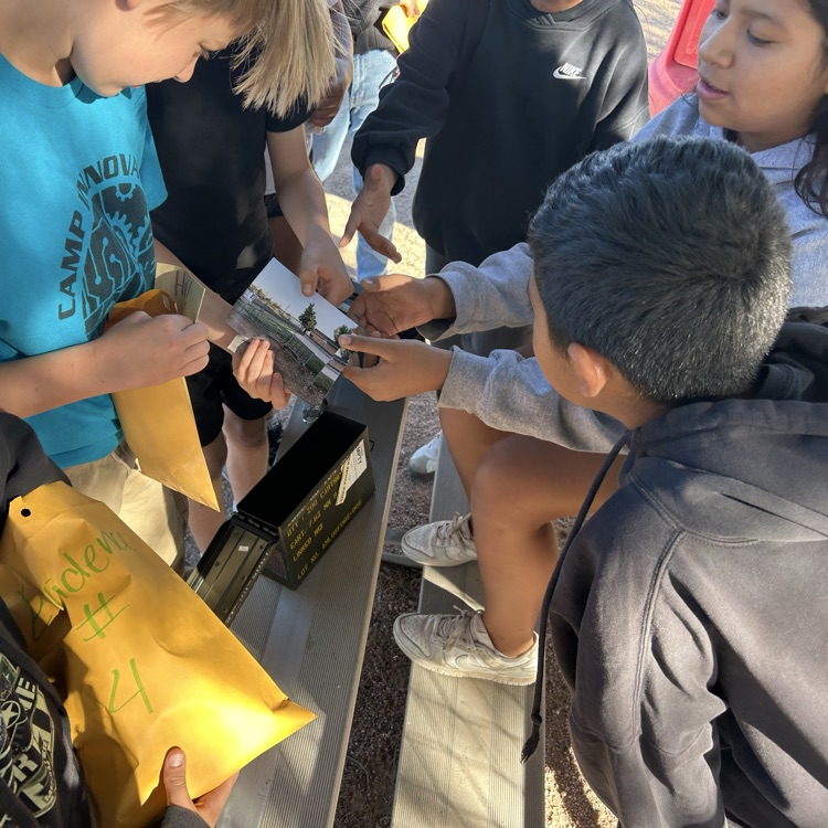 students figuring out puzzle to unlock clues