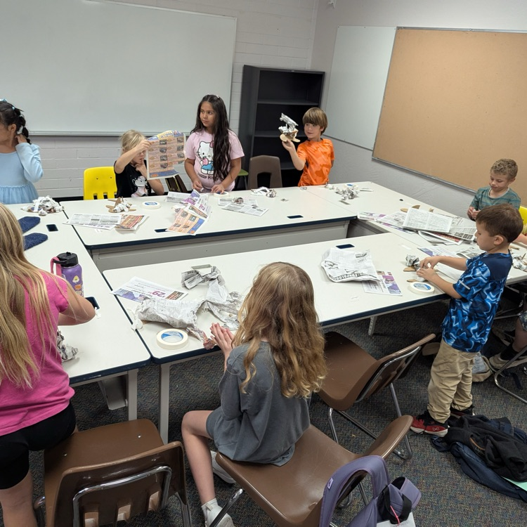 students painting papermache' marine mammals