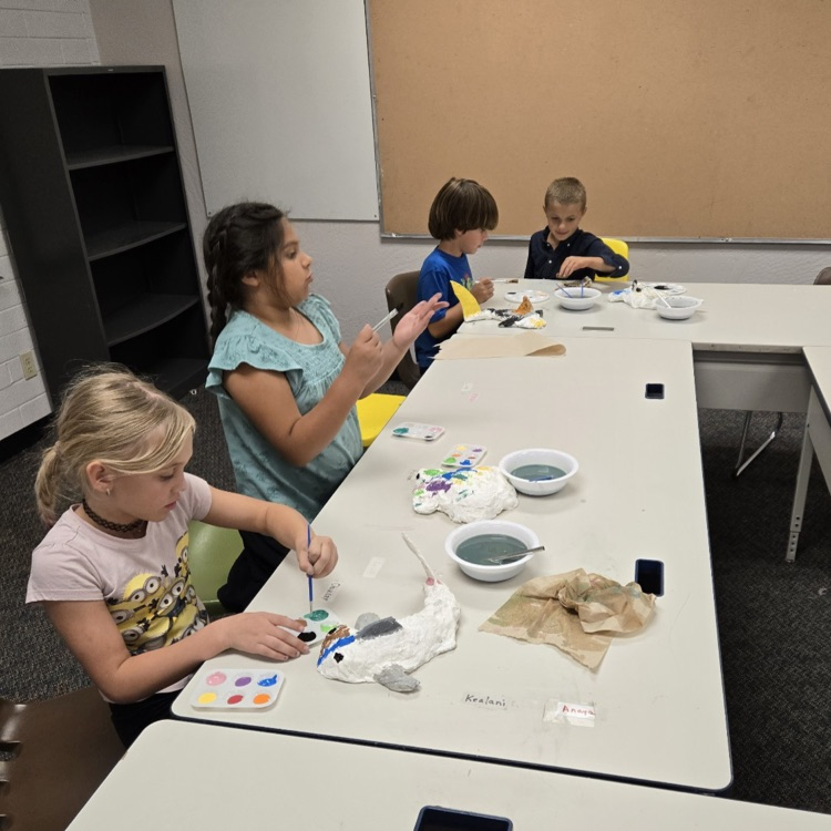 students painting papier mache'