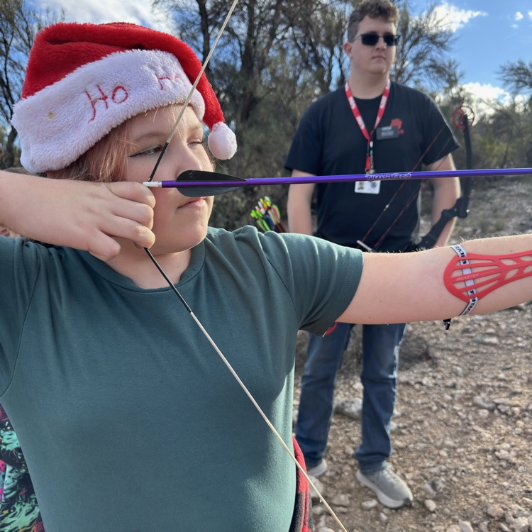 student aiming bow