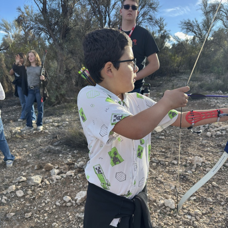 student aiming bow