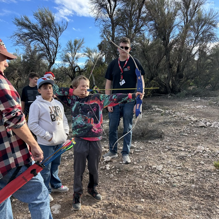 student aiming bow