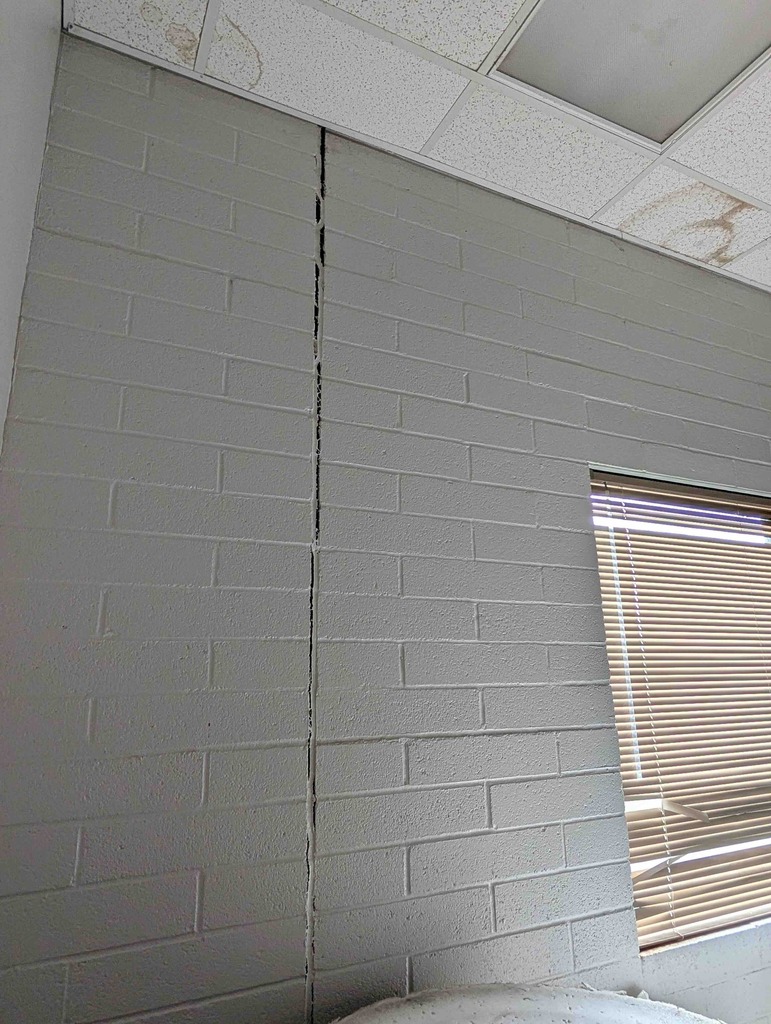 Gym wall pulling away due to structural damage