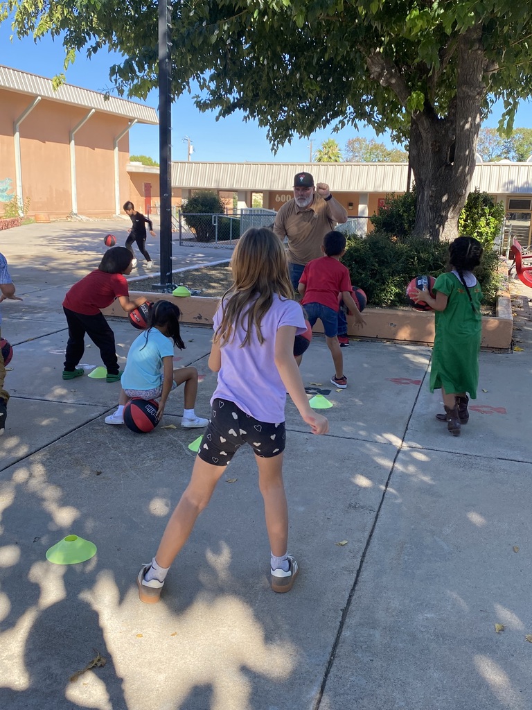 Little Lobo Dribblers learning how to dribble a basketball