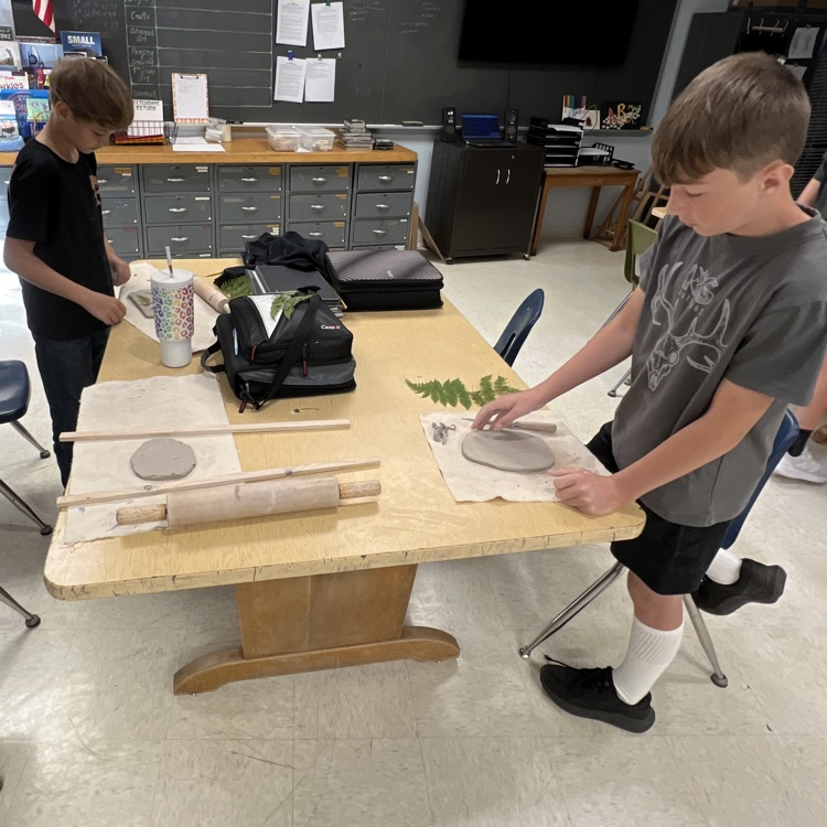 students working on their clay projects.  