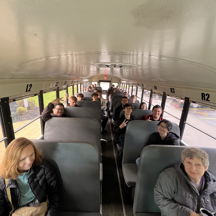students on a bus on their way to Alfred State.