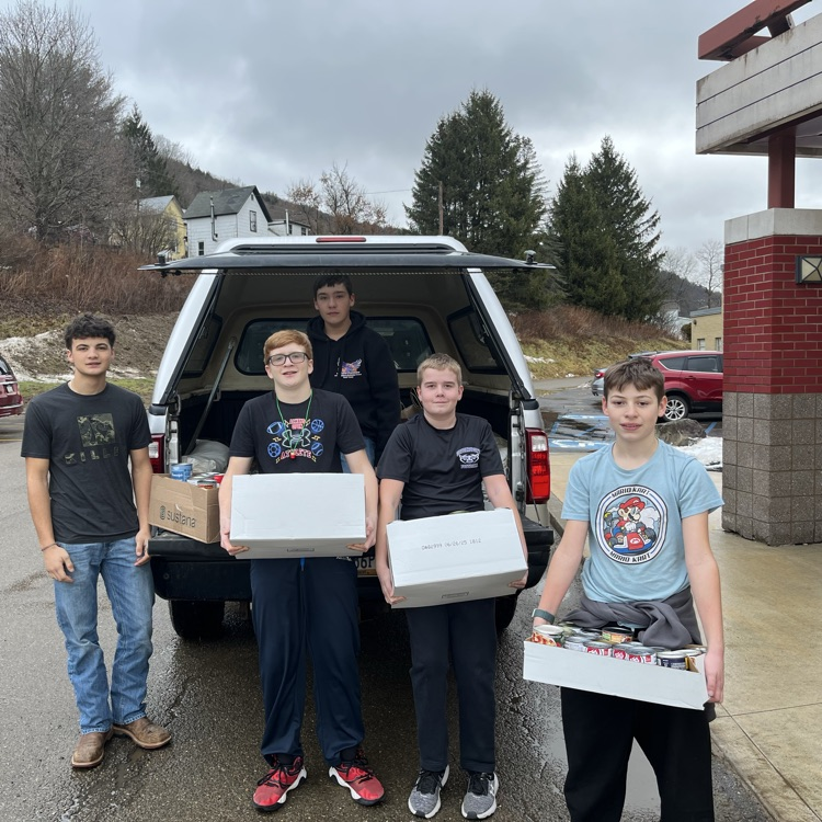 students loading cans for the food pantry  