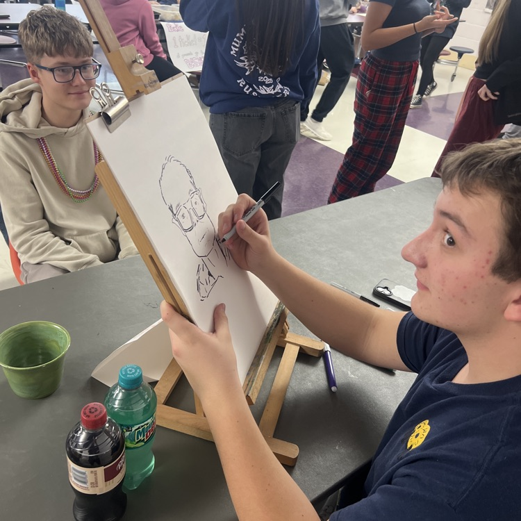 student doing artwork 